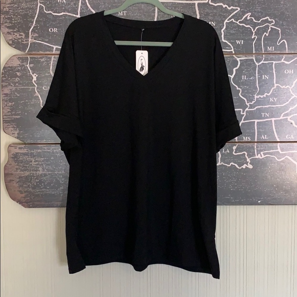 Black V neck w/ cuffed arm opening & split sides